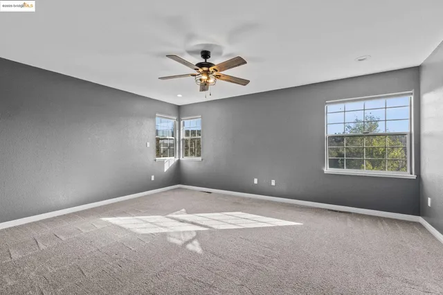 a spacious bathroom with a tub shower and sink