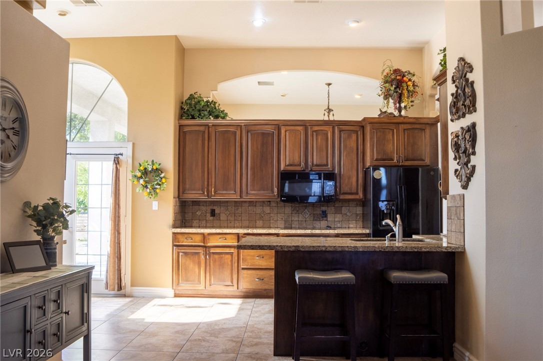 2775 Taylor Street Logandale, NV 89021 - Photo 18 of 41 This spacious kitchen offers a functional layout with ample cabinetry and a convenient breakfast bar.