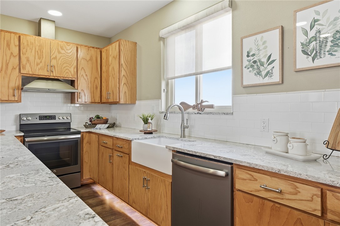 4642 Lackey Taft, TX 78390 - Photo 14 of 40 a kitchen with a sink cabinets and window