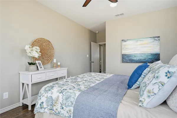 a bedroom with a bed and a dresser