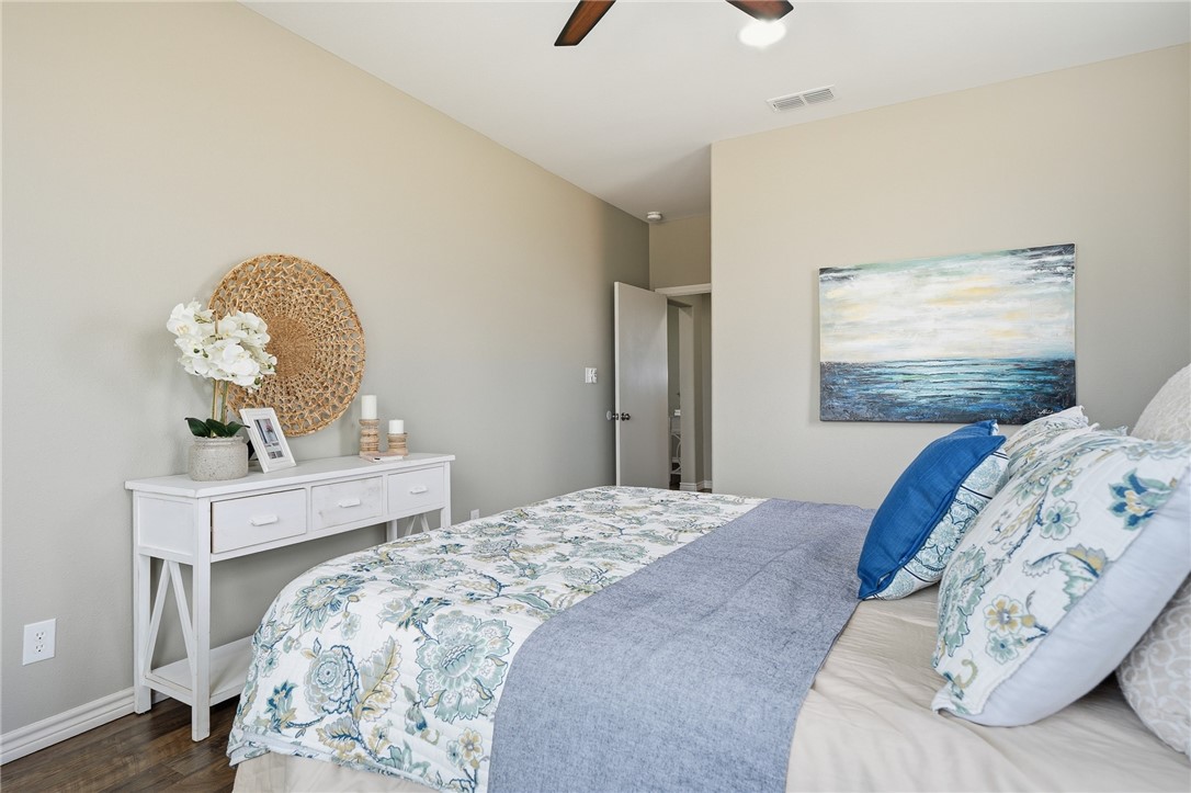 4642 Lackey Taft, TX 78390 - Photo 19 of 40 a bedroom with a bed and a dresser