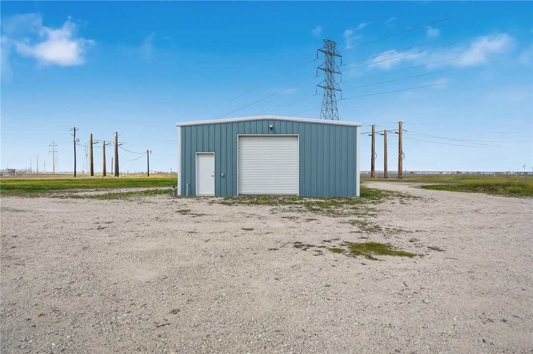 4642 Lackey Taft, TX 78390 - Photo 31 of 40 a front view of a house with a yard