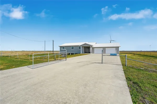 a view of a terrace with a table and chairs