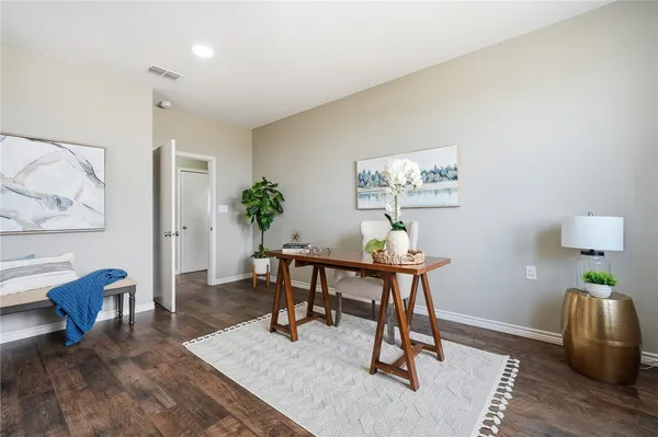 a workspace with furniture and wooden floor