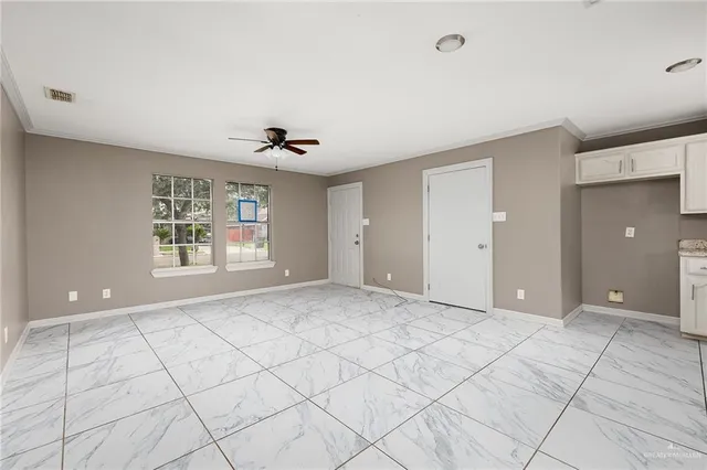 a view of an empty room with a window