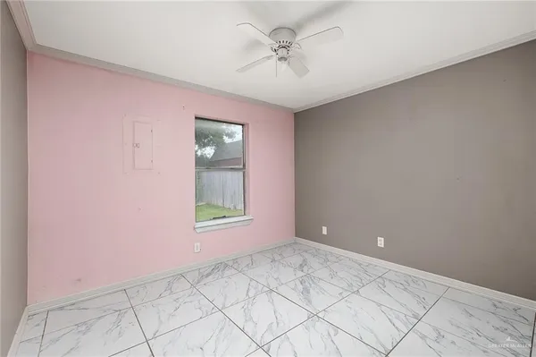 a view of an empty room with a window