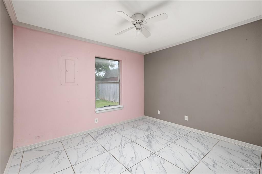 3900 Gabriella Drive Weslaco, TX 78599 - Photo 8 of 12 a view of an empty room with a window