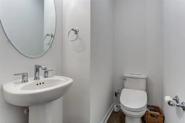 a bathroom with a toilet and a sink