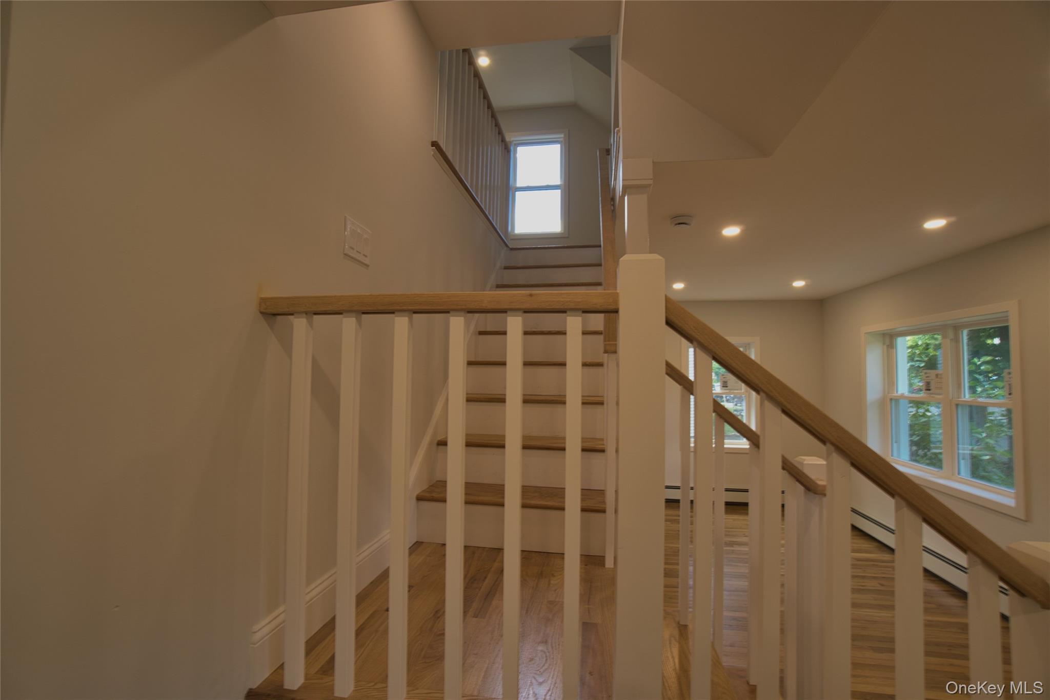 29 Overlin Road Patterson, NY 12563 - Photo 13 of 16 Staircase featuring wood-finish treads and handrails with white balusters