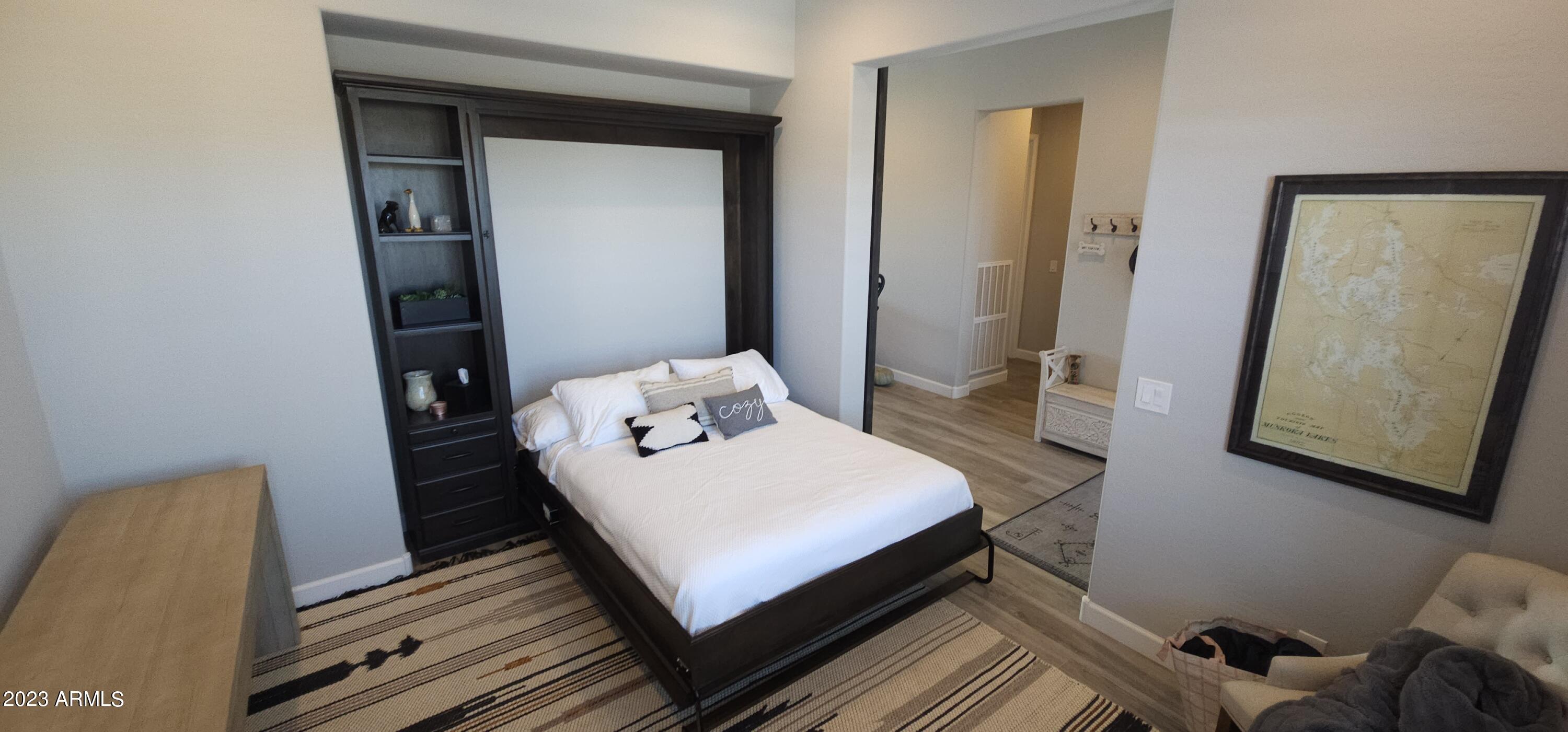 17835 East Cindercone Road Rio Verde, AZ 85263 - Photo 12 of 57 a bedroom with a bed and wooden floor