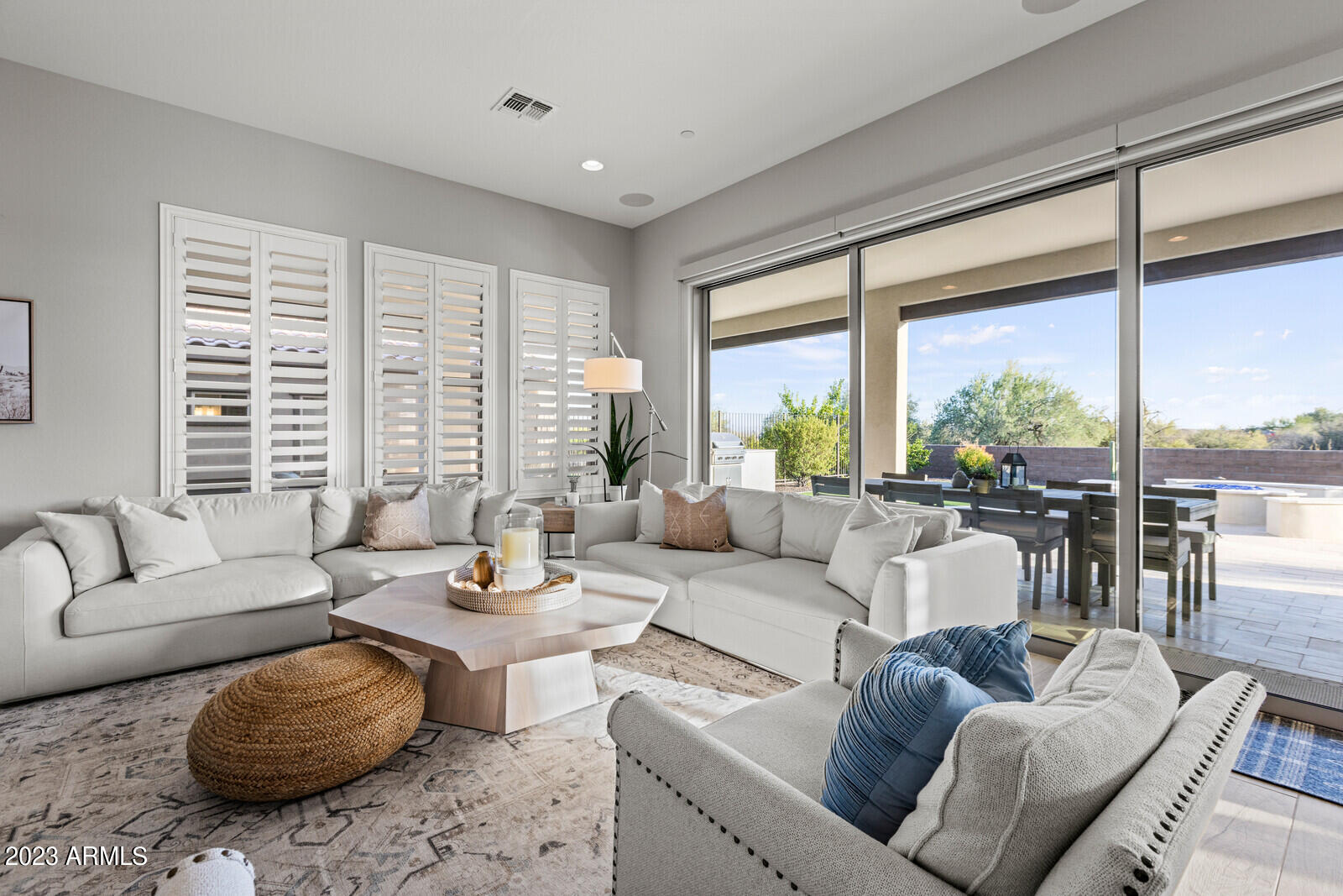 17835 East Cindercone Road Rio Verde, AZ 85263 - Photo 14 of 57 a living room with furniture and floor to ceiling windows