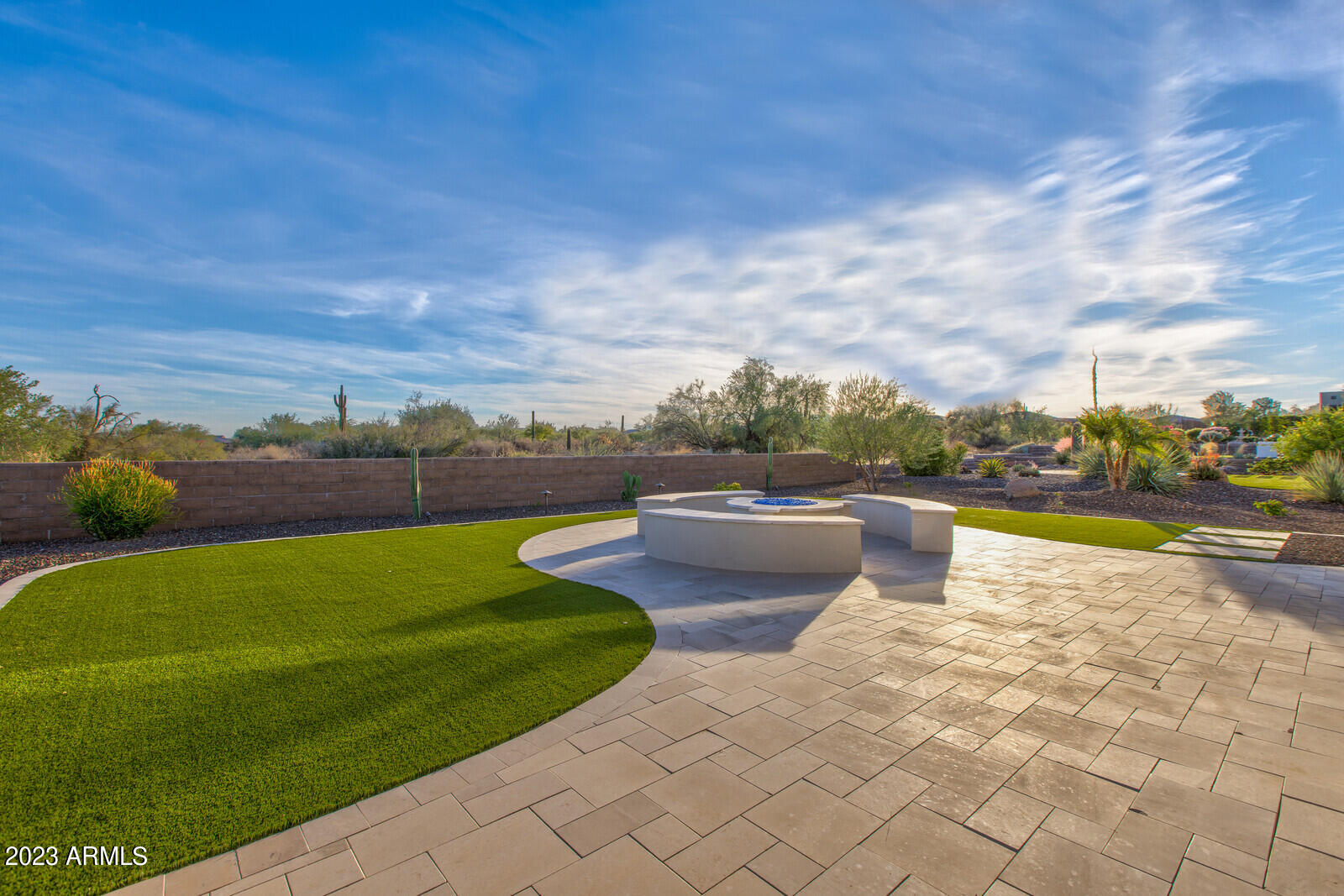 17835 East Cindercone Road Rio Verde, AZ 85263 - Photo 3 of 57 a view of a swimming pool and lounge chairs in the terrace