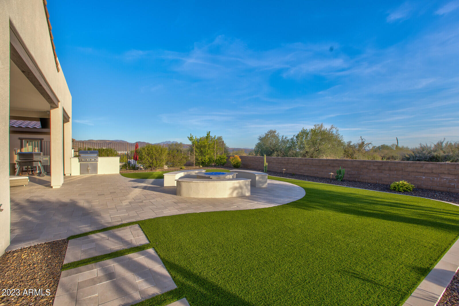 17835 East Cindercone Road Rio Verde, AZ 85263 - Photo 32 of 57 a view of a swimming pool with lounge chairs
