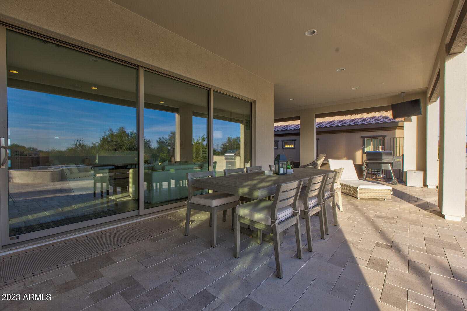 17835 East Cindercone Road Rio Verde, AZ 85263 - Photo 33 of 57 a dining room with furniture and a floor to ceiling window