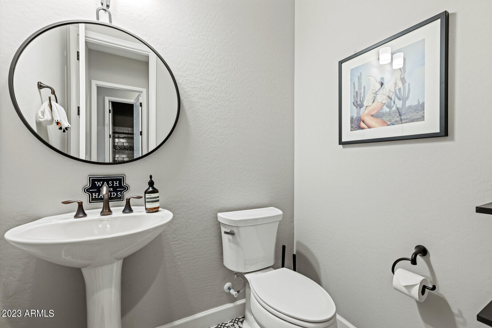 17835 East Cindercone Road Rio Verde, AZ 85263 - Photo 38 of 57 a bathroom with a toilet sink and mirror