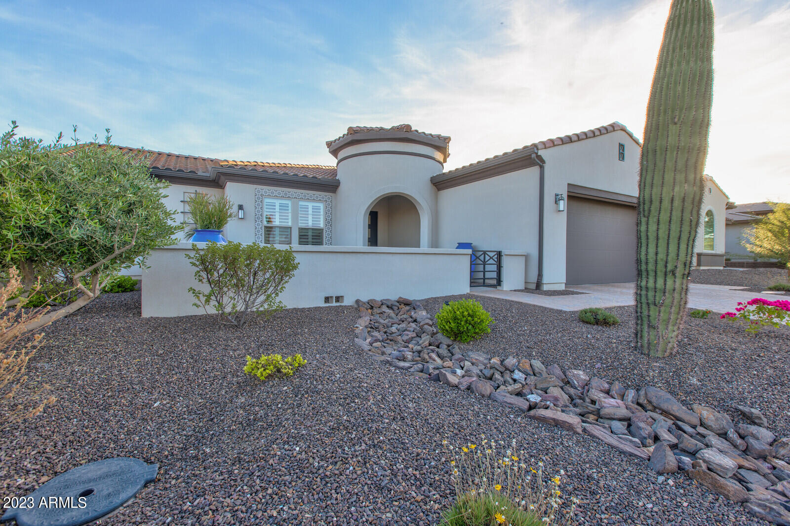 17835 East Cindercone Road Rio Verde, AZ 85263 - Photo 6 of 57 a front view of a house with a yard and garage