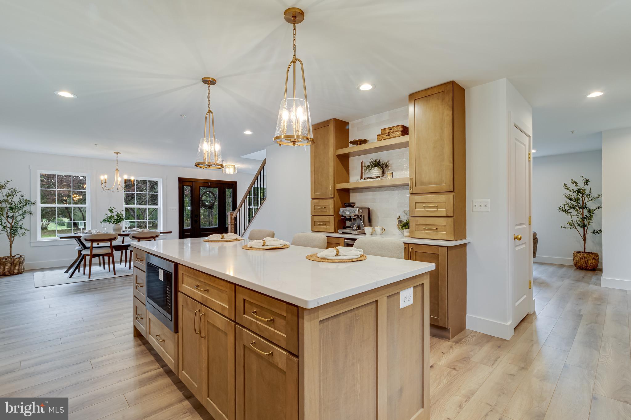 1940 Adelina Road Prince Frederick, MD 20678 - Photo 12 of 37 a kitchen with a sink a counter top space and stainless steel appliances