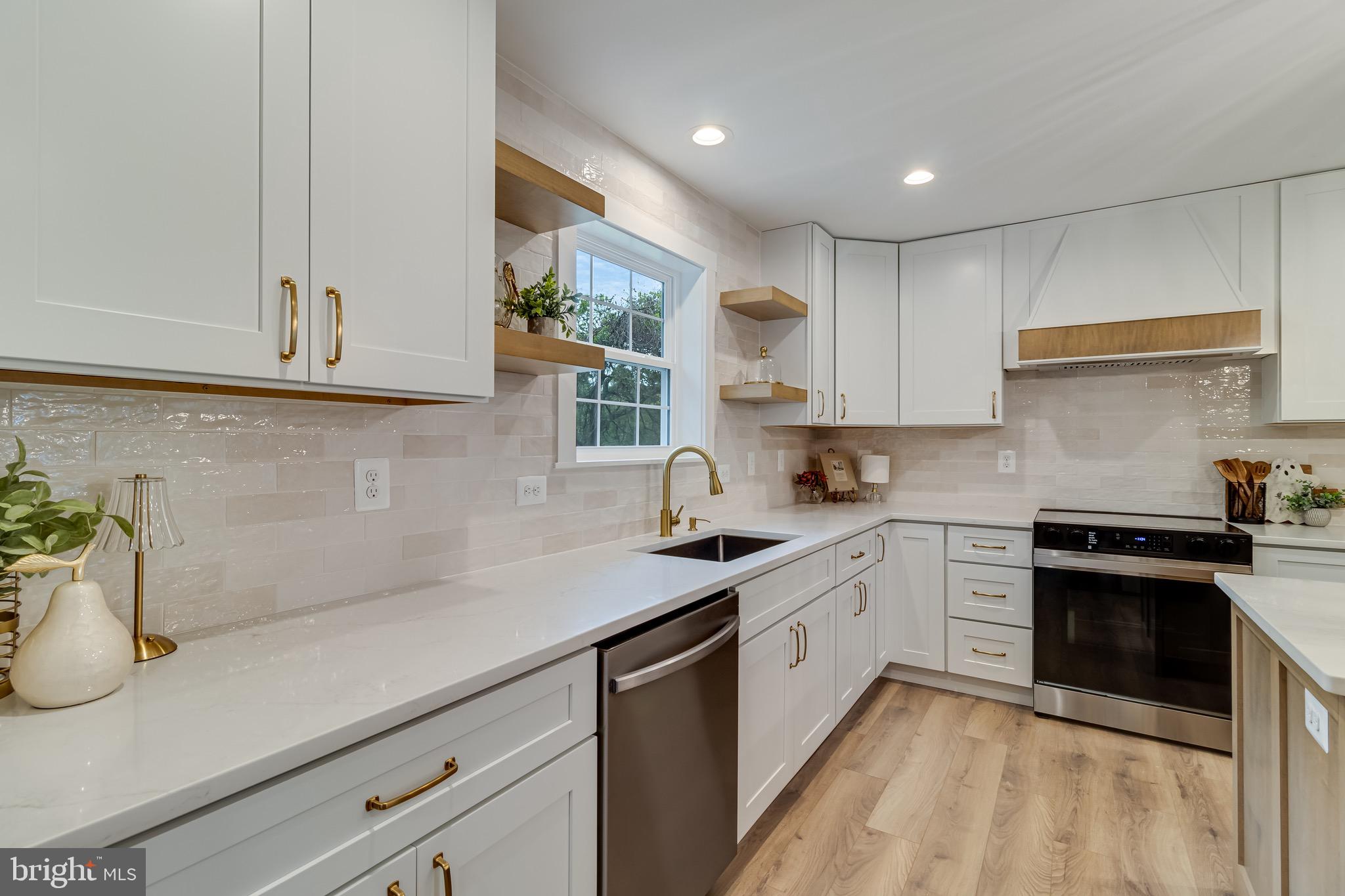 1940 Adelina Road Prince Frederick, MD 20678 - Photo 14 of 37 a kitchen with a sink and cabinets