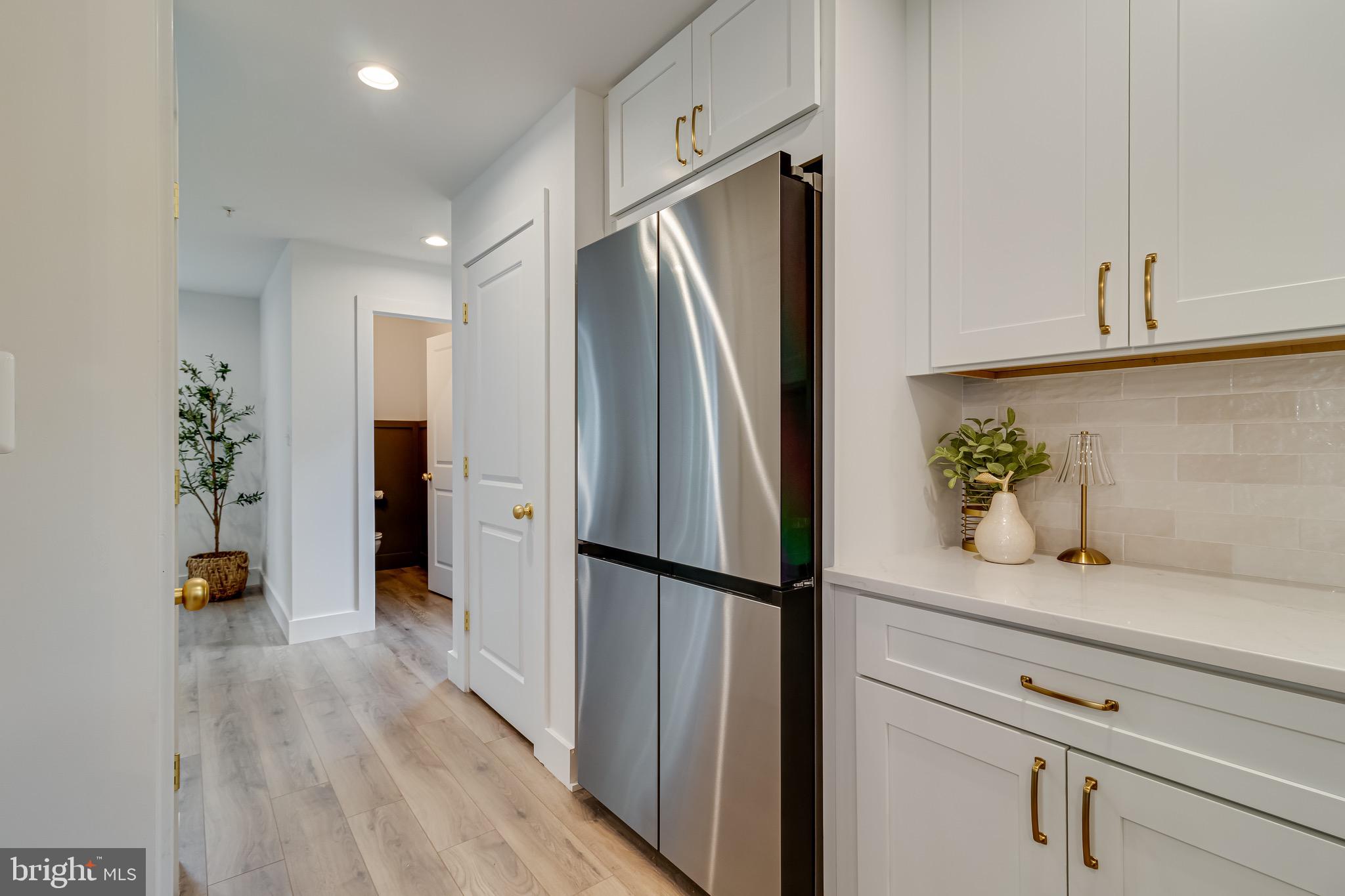 1940 Adelina Road Prince Frederick, MD 20678 - Photo 15 of 37 a kitchen with stainless steel appliances a refrigerator and a potted plant