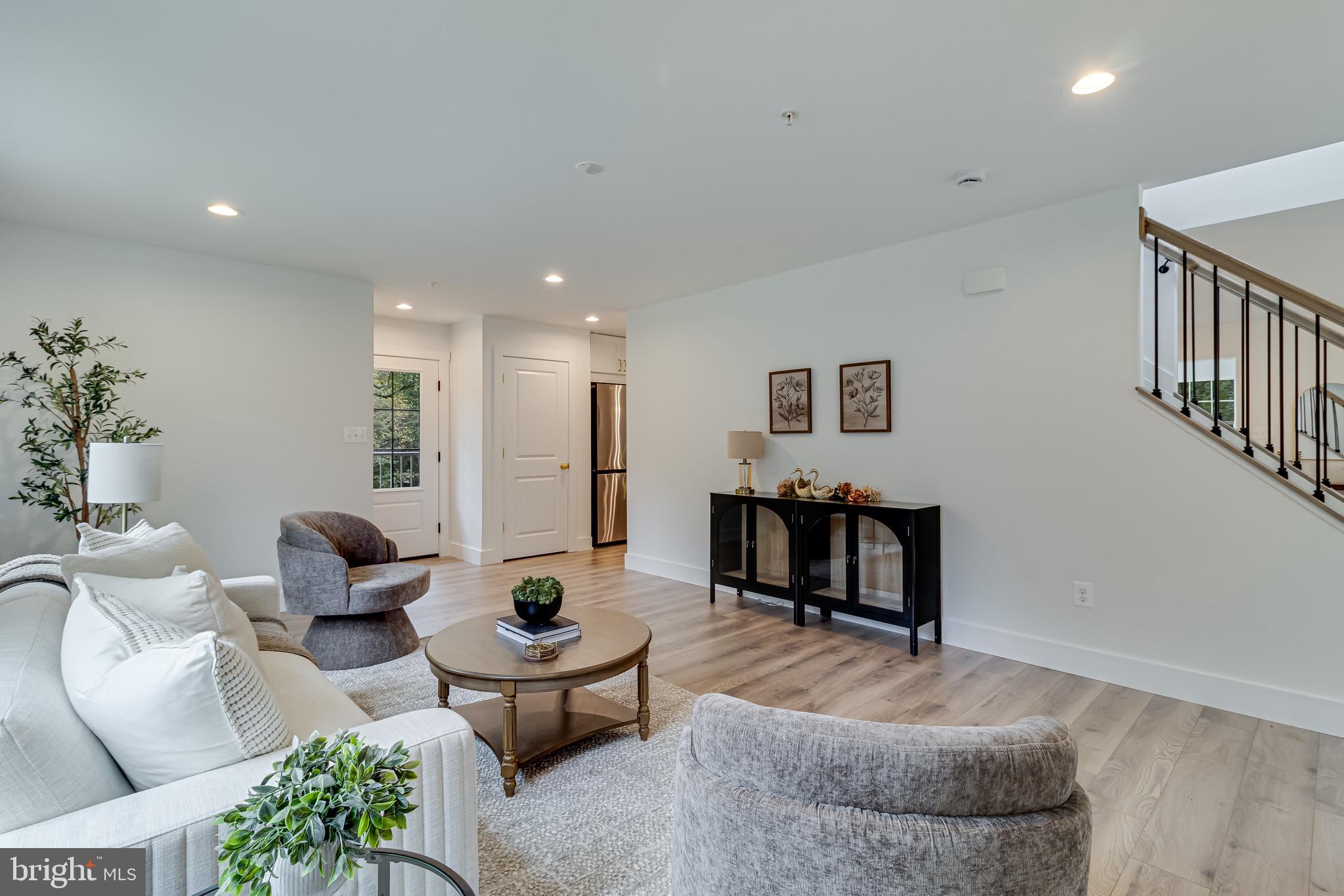 1940 Adelina Road Prince Frederick, MD 20678 - Photo 20 of 37 a living room with furniture and a table