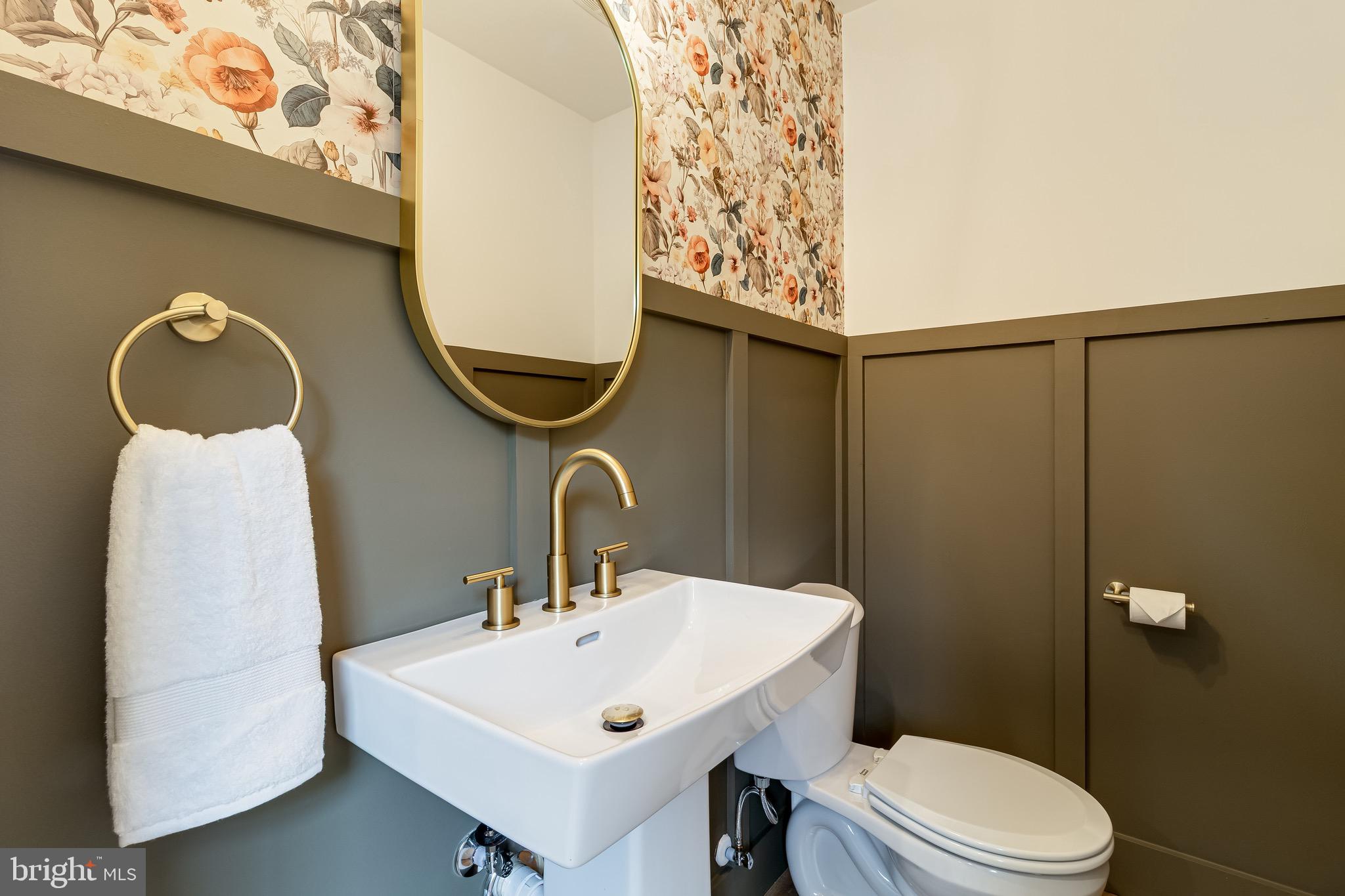 1940 Adelina Road Prince Frederick, MD 20678 - Photo 21 of 37 a bathroom with a sink mirror and toilet