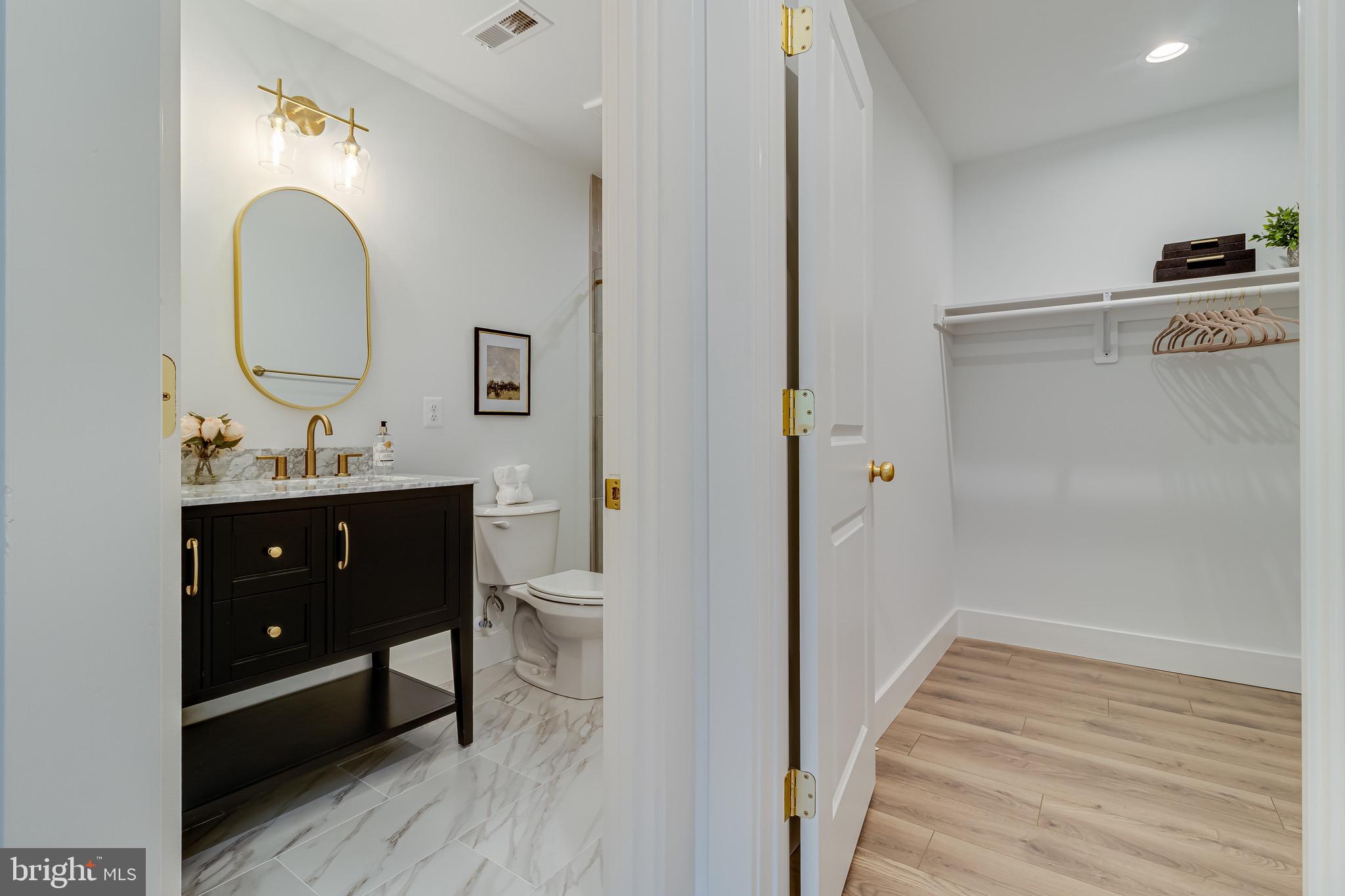 1940 Adelina Road Prince Frederick, MD 20678 - Photo 23 of 37 a bathroom with a sink and a mirror