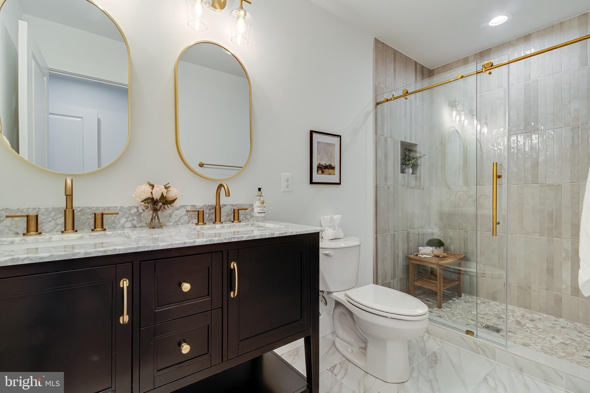 1940 Adelina Road Prince Frederick, MD 20678 - Photo 24 of 37 a bathroom with a toilet a sink and a mirror