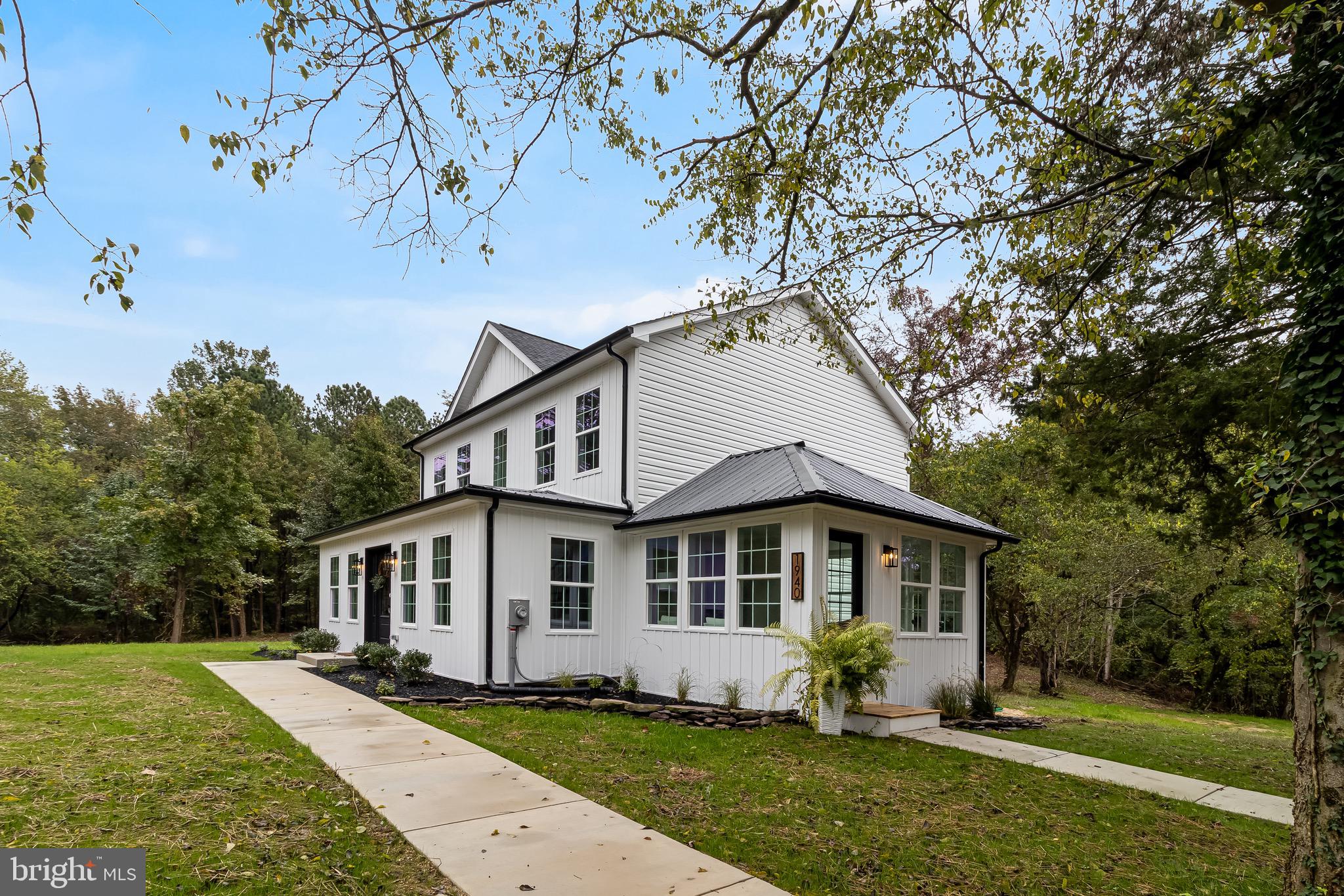 1940 Adelina Road Prince Frederick, MD 20678 - Photo 3 of 37 a front view of a house with a yard
