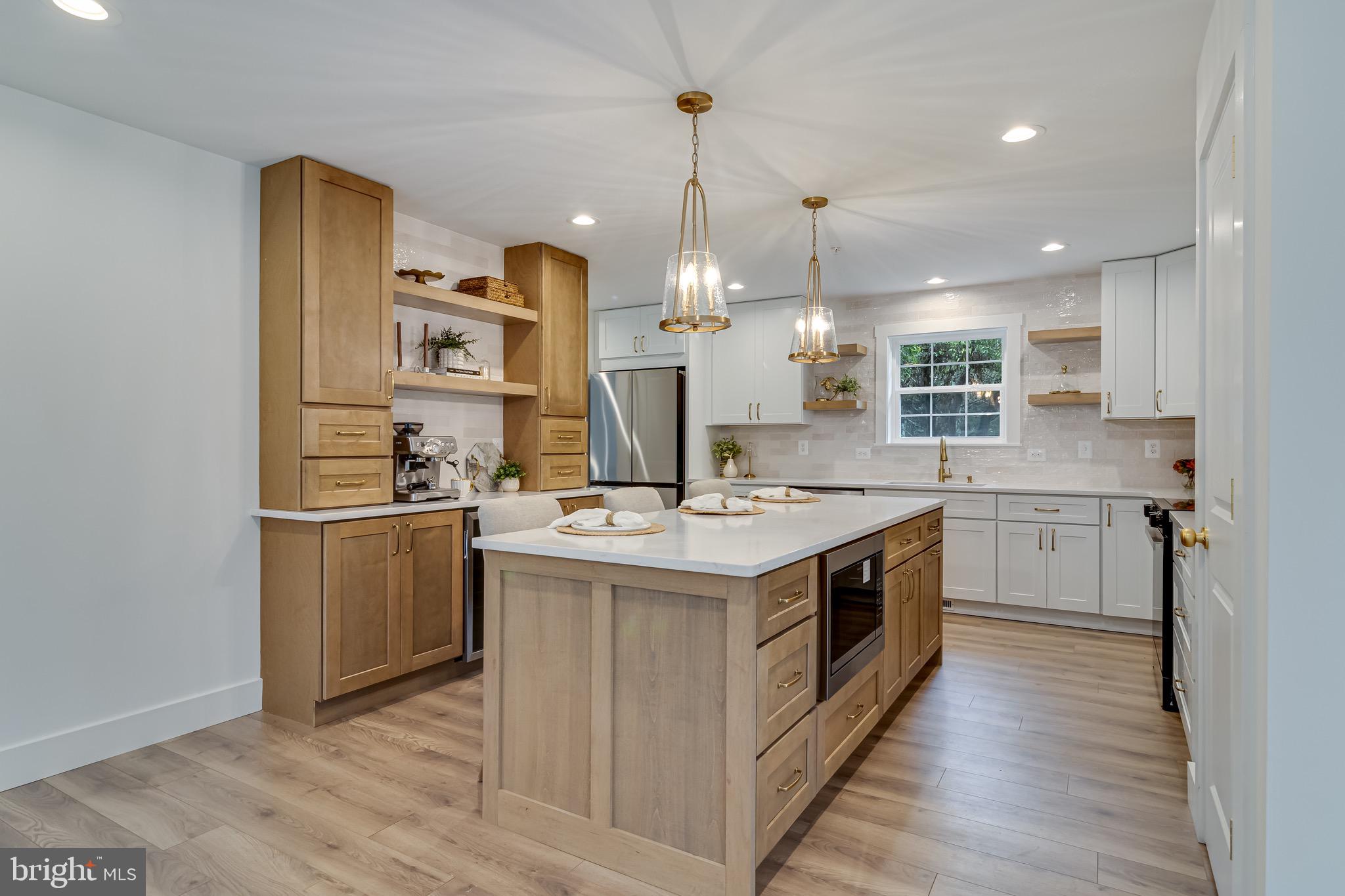 1940 Adelina Road Prince Frederick, MD 20678 - Photo 10 of 37 a kitchen with a stove and a refrigerator