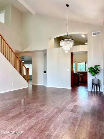 a view of an entryway with wooden floor