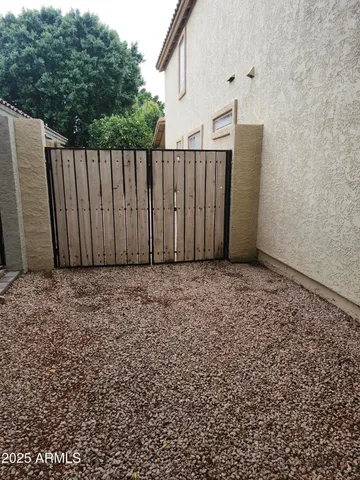 a view of a house with a yard and plants