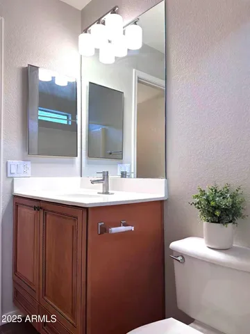 a view of hallway with wooden floor