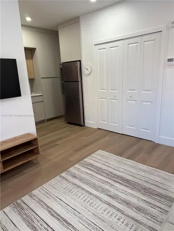 a view of a livingroom with wooden floor