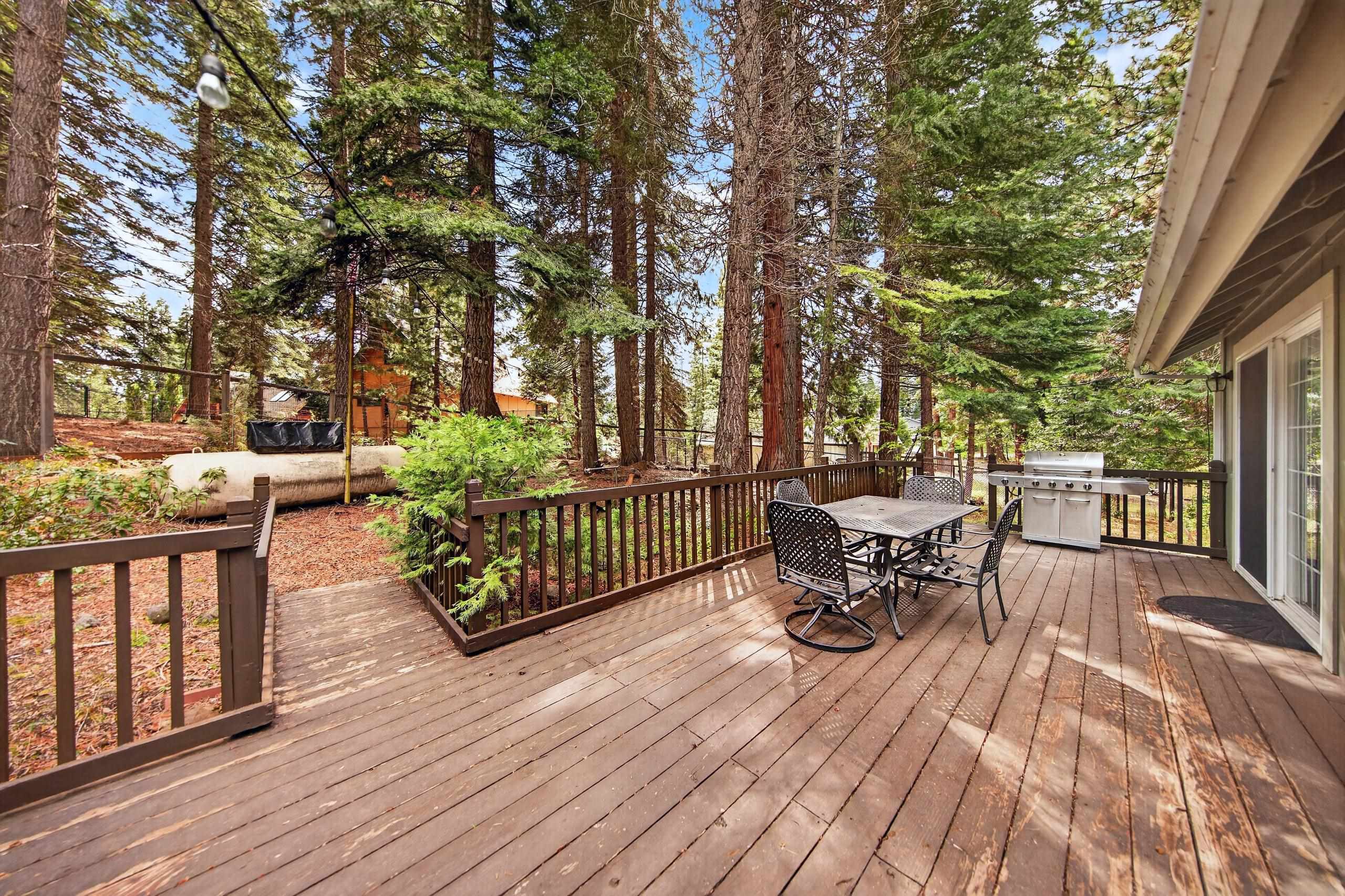 1220 Lynx Road Lake Almanor, CA 96137 - Photo 30 of 45 a view of a patio with a table and chairs