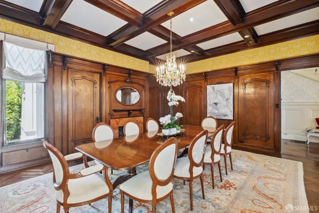 a dining room with furniture and window
