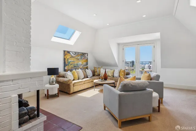 a living room with furniture and a rug