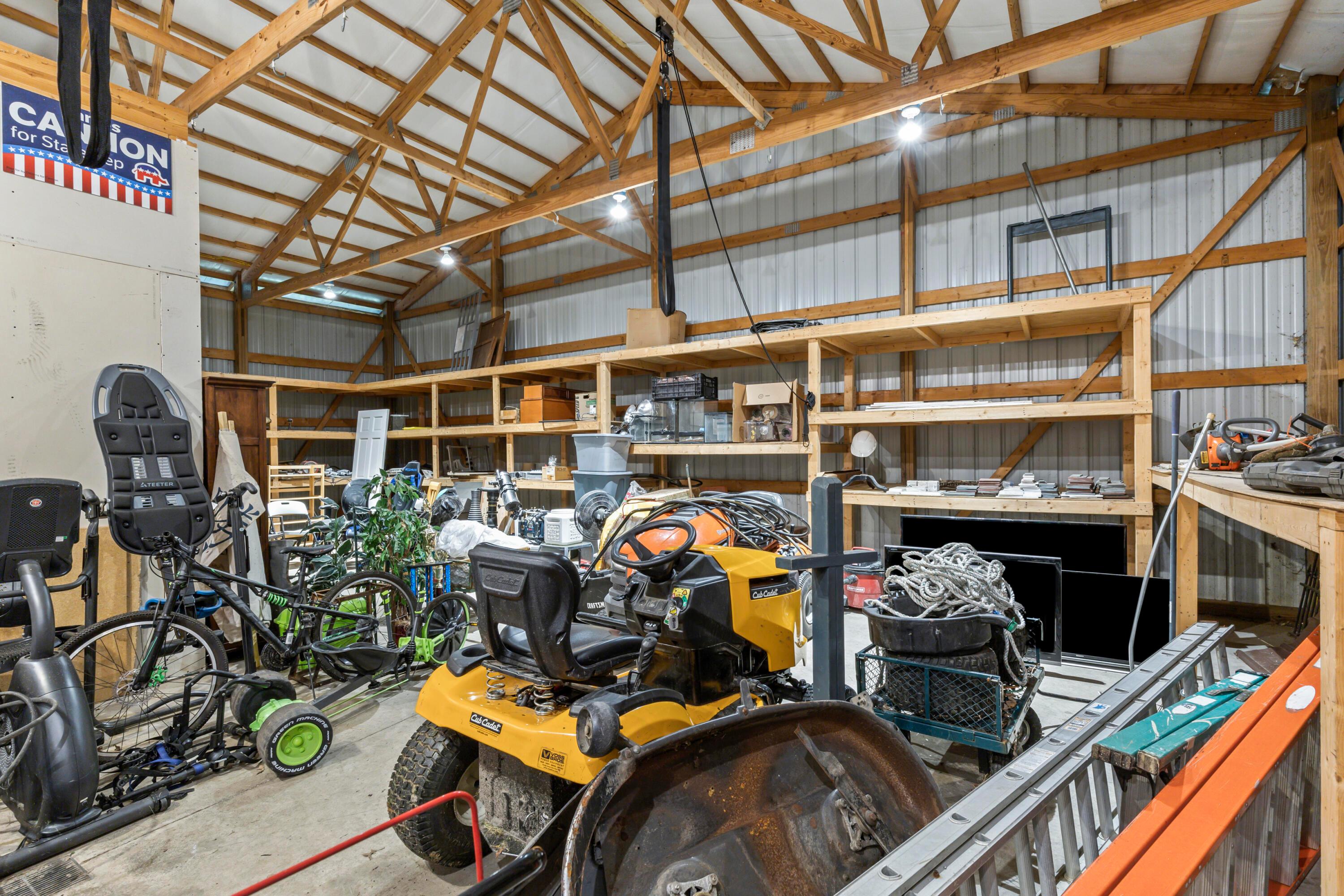 9495 Kilbourne Road Sunbury, OH 43074 - Photo 66 of 84 • Concrete flooring
• Loft area for storage
• Liftmaster® electric door opener
(does not work)
• Atrium door to side yard
• 4 foot deep wooden shelves
• New 10’ high garage door
~2003
• 18’ x 24’ heated workshop