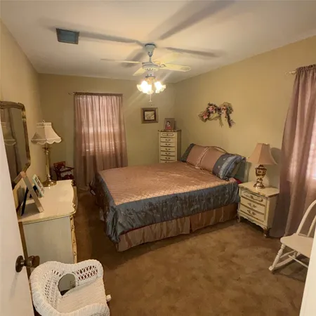 a bedroom with a bed and furniture