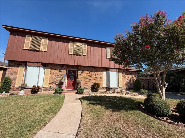 a view of a building with a yard