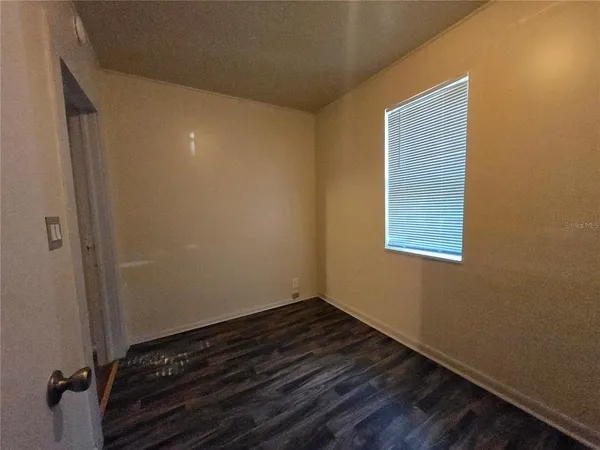 a view of small space with wooden floor