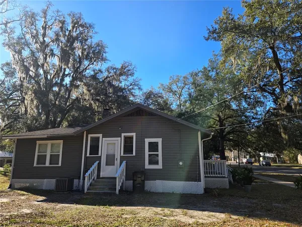 a front view of a house with yard
