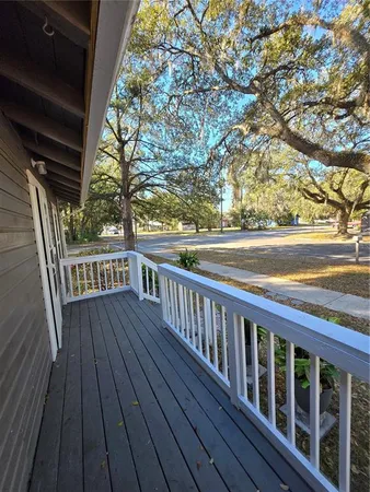 a view of wooden balcony with wooden floor and fence