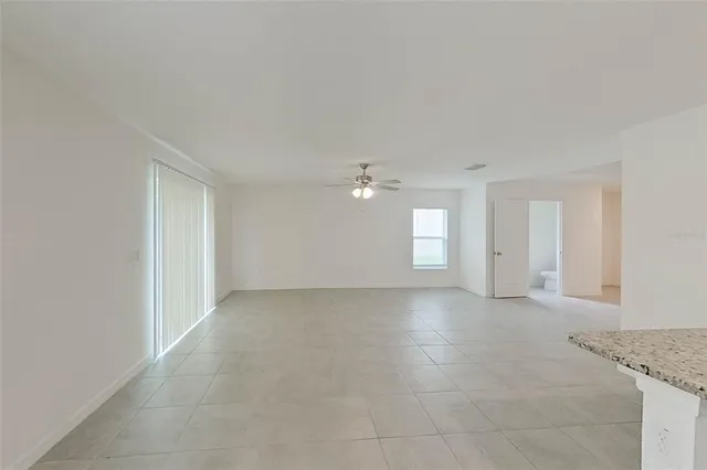 a kitchen with a refrigerator sink and wooden cabinets