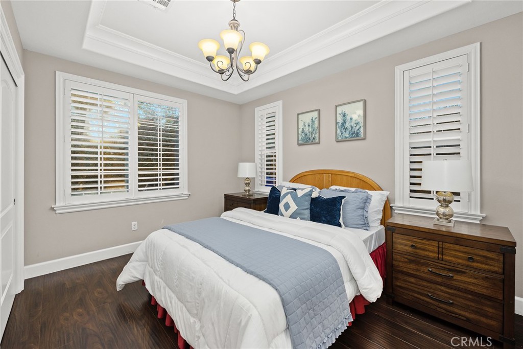 2641 Doolittle Avenue Arcadia, CA 91006 - Photo 11 of 13 a bedroom with a bed and a chandelier