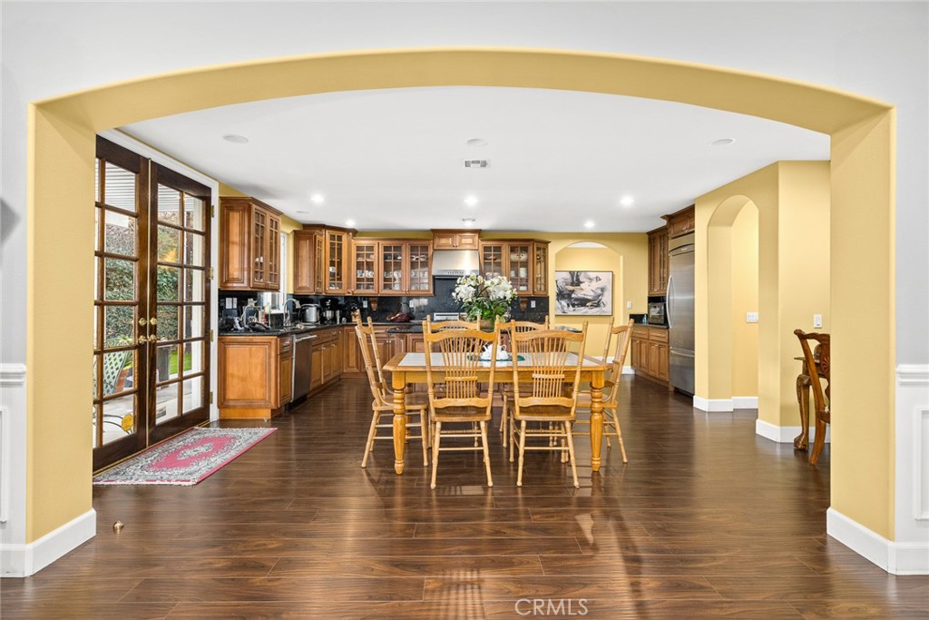 2641 Doolittle Avenue Arcadia, CA 91006 - Photo 10 of 13 a dining room with wooden floor a glass table and chairs