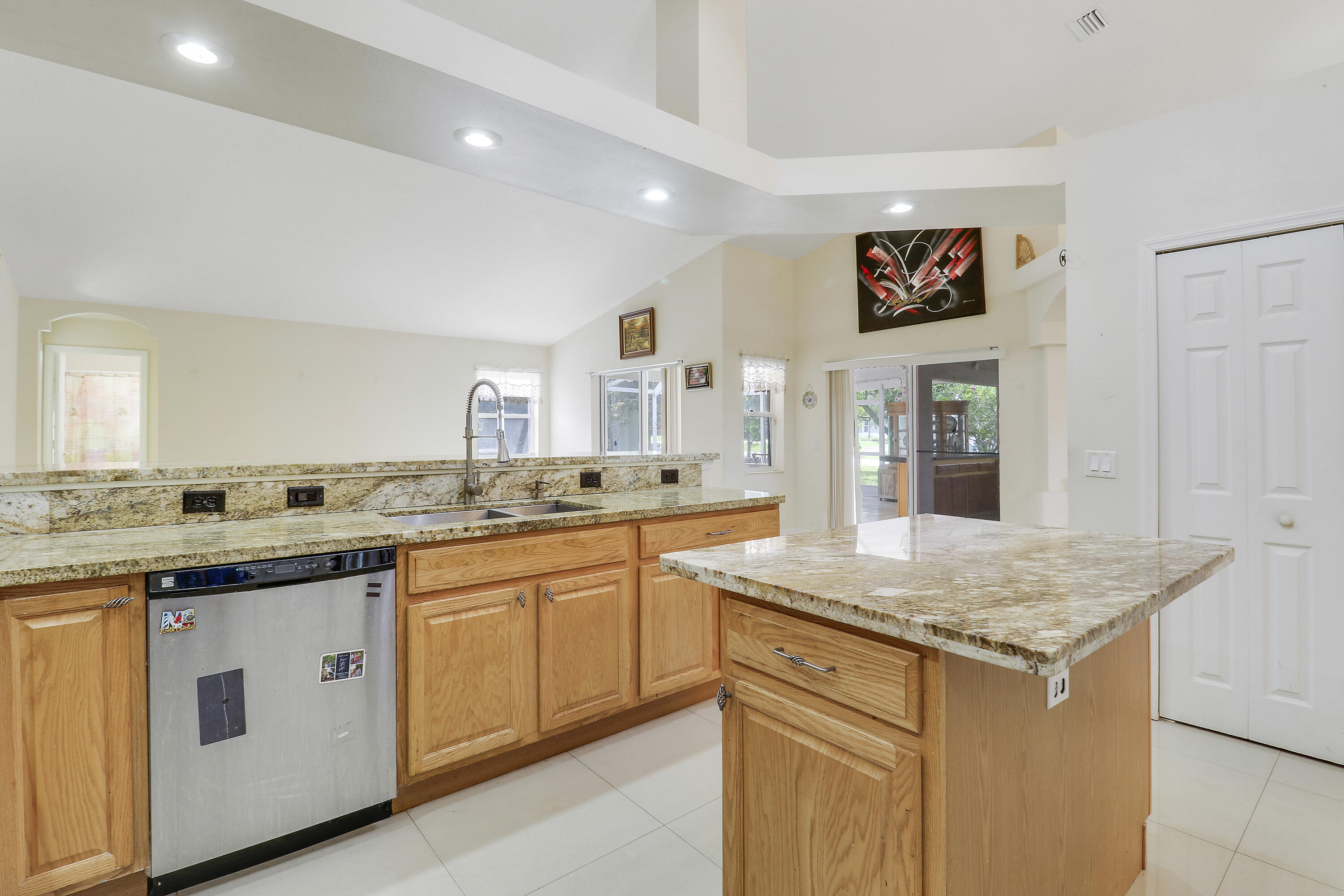 2085 Southwest Aladdin Street Port St. Lucie, FL 34953 - Photo 19 of 45 a kitchen with a sink stove and cabinets