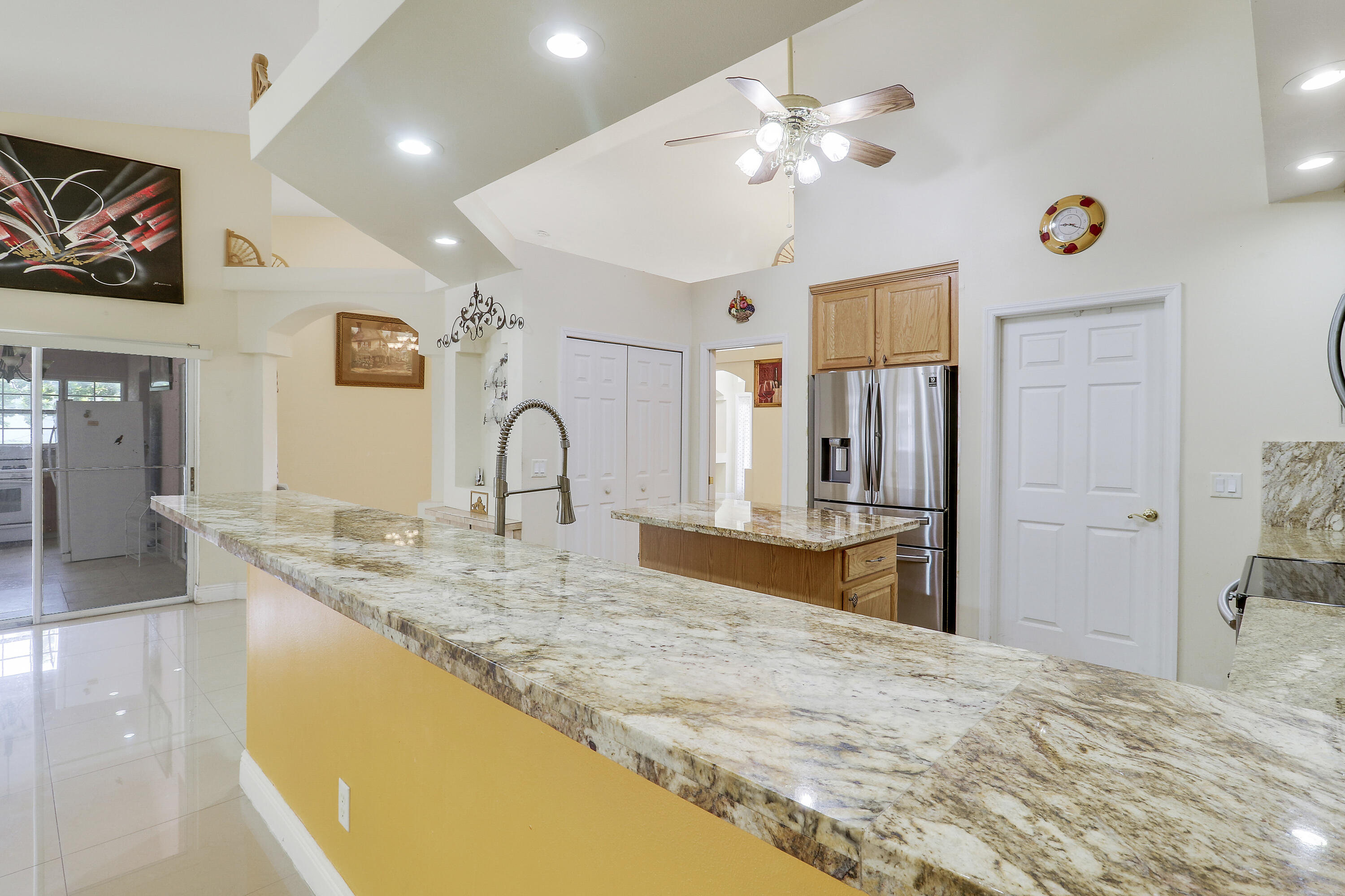 2085 Southwest Aladdin Street Port St. Lucie, FL 34953 - Photo 20 of 45 a spacious bathroom with a granite countertop sink a mirror and shower
