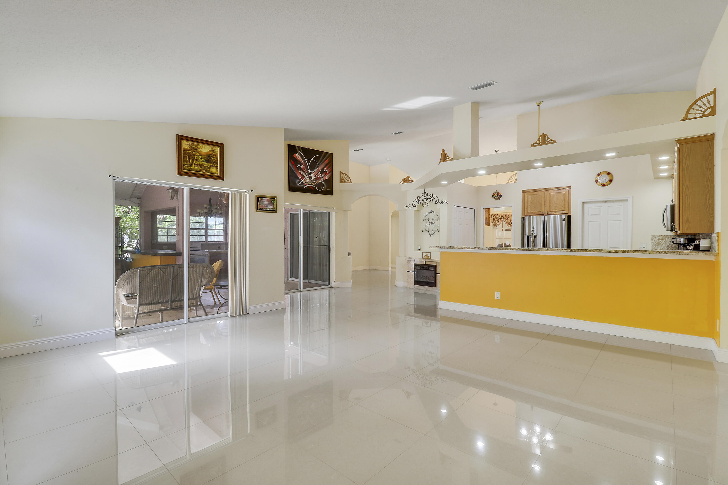 2085 Southwest Aladdin Street Port St. Lucie, FL 34953 - Photo 23 of 45 a view of a kitchen with furniture and wooden floor
