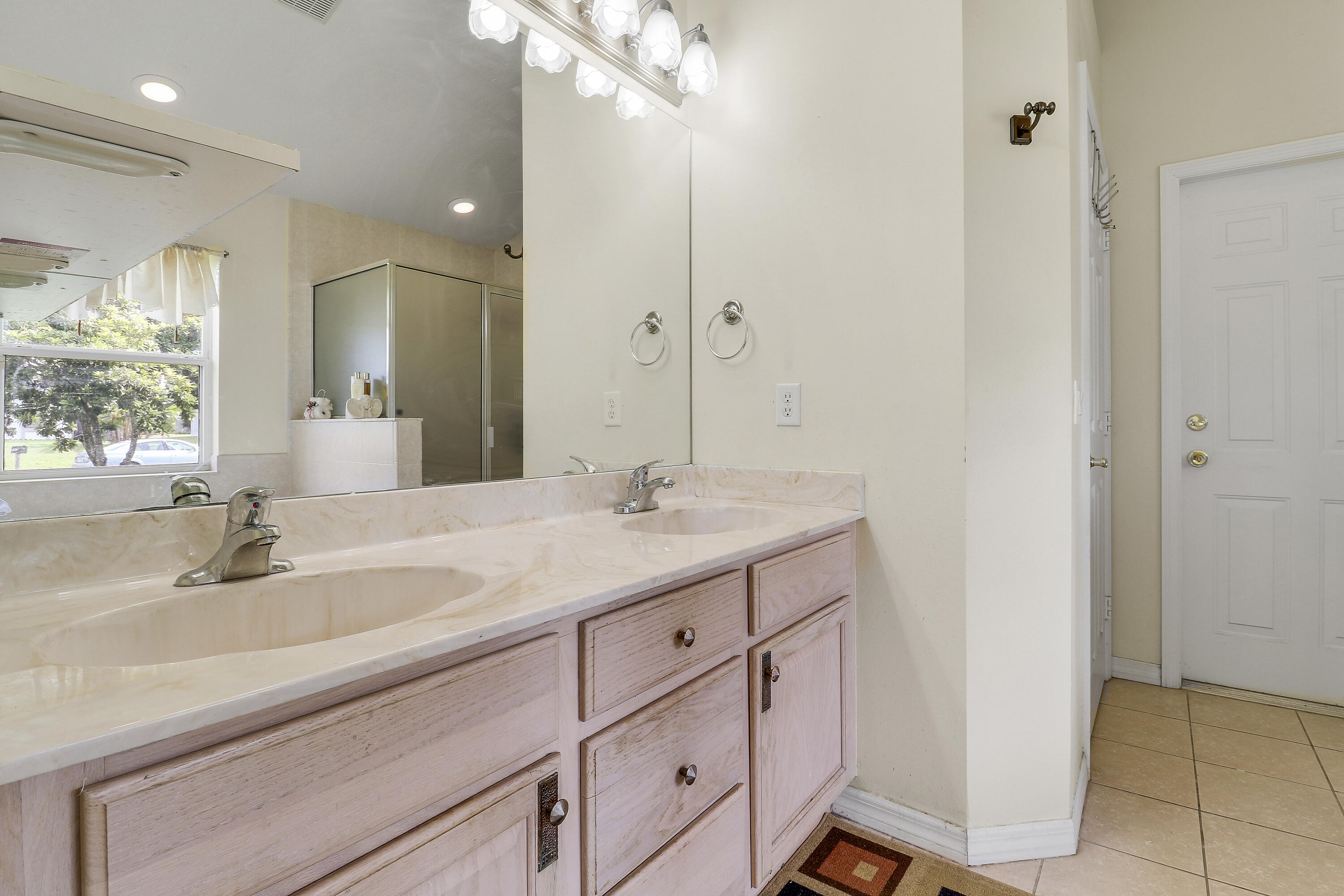 2085 Southwest Aladdin Street Port St. Lucie, FL 34953 - Photo 29 of 45 a bathroom with a sink double vanity and a mirror