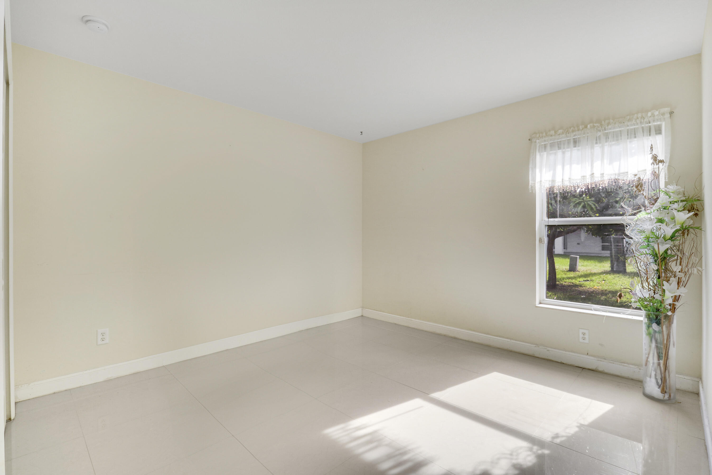 2085 Southwest Aladdin Street Port St. Lucie, FL 34953 - Photo 31 of 45 an empty room with windows